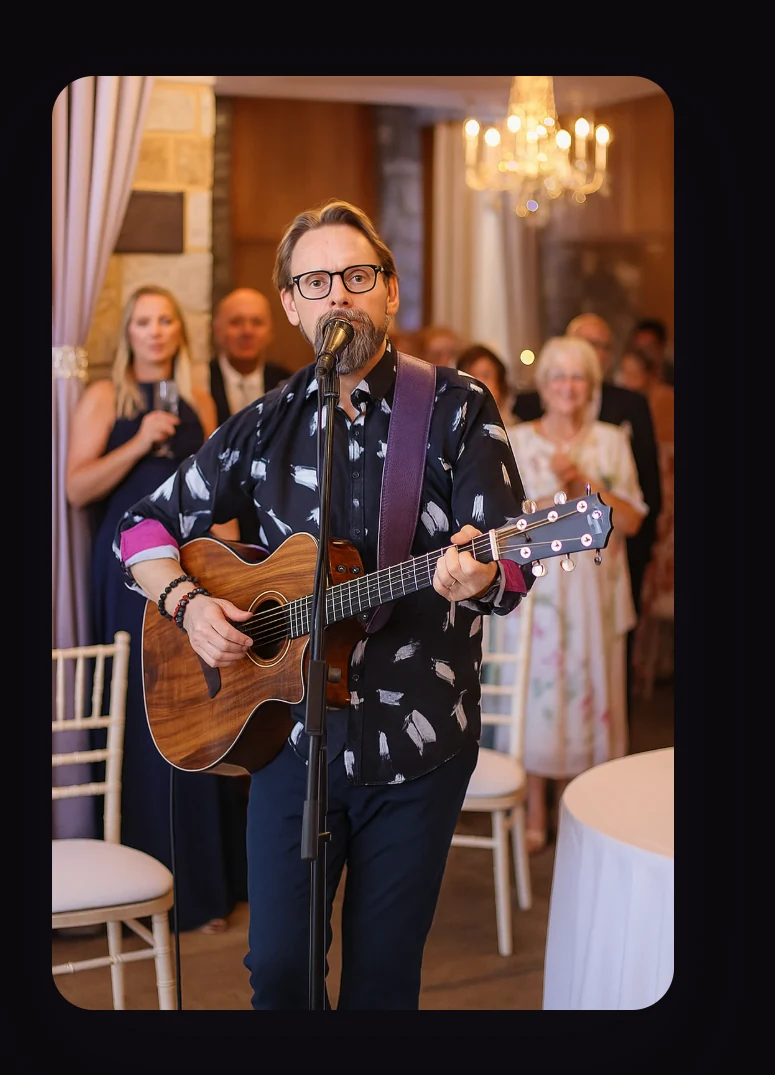 Shane Joseph performing live music at an event