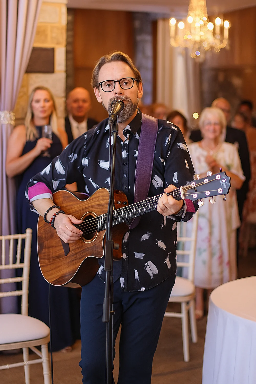 Shane Joseph singing and playing guitar at a live event