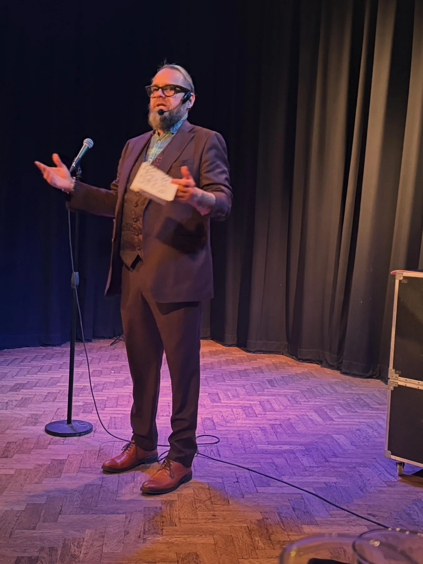 Shane Joseph performing and hosting on stage